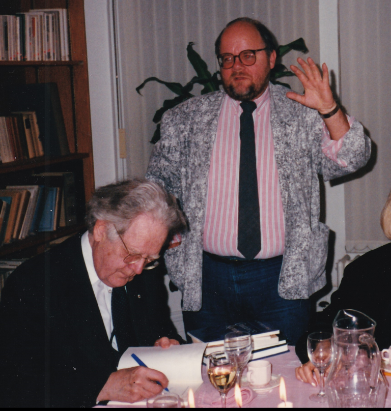 Northrop Frye autographing Greg Gatenby’s collection of his books